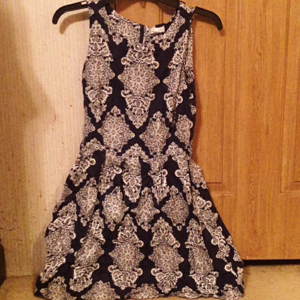 A blue and white sleeveless dress